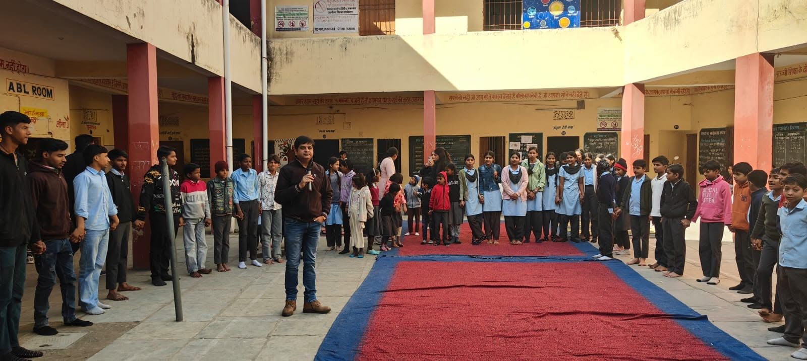 School students training in a theatre workshop session